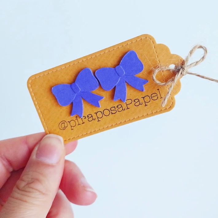 Moños aretes tono morado