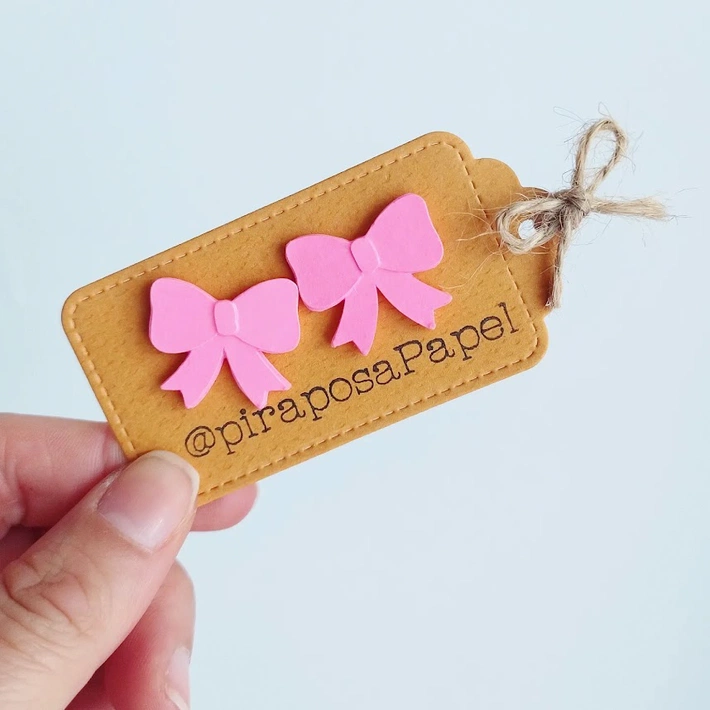 Moños aretes tono rosado